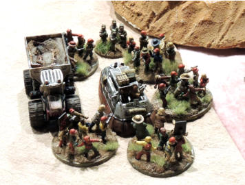 A combat car surrounded by amilitia infantry attack