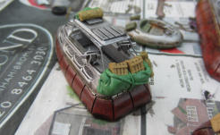 Extra solid splinter shield added to comat car. Body black washed and GreenStuff stowage added