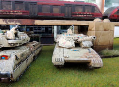 Gryphon medium tank and Zentaur heavy tank - both carry 2cm Tribarrel powerguns as secondary armament