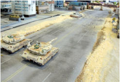 Antargran Zentaur heavy tanks (Khurasan) face a lone Blower (Ainsty) who has broken through in Clyde City