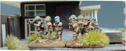 Infantry with various weapons including conebores, flame throwers and anti tankbuzzbombs in half armour and with field berrets