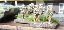 Infantry squad and Tankhunters with Buzzbombs and coil-gun assault rifles and Support weapon