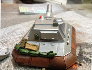 The rear stowage with Brigade metal stowage and putty tarp, all inked