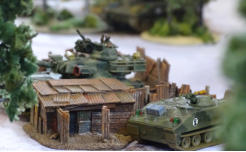 Shacks provide some cover for AFVs and infantry