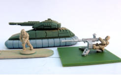 AFV with basic spray colours and infantry in Skeleton Bone with a natural metal support weapon